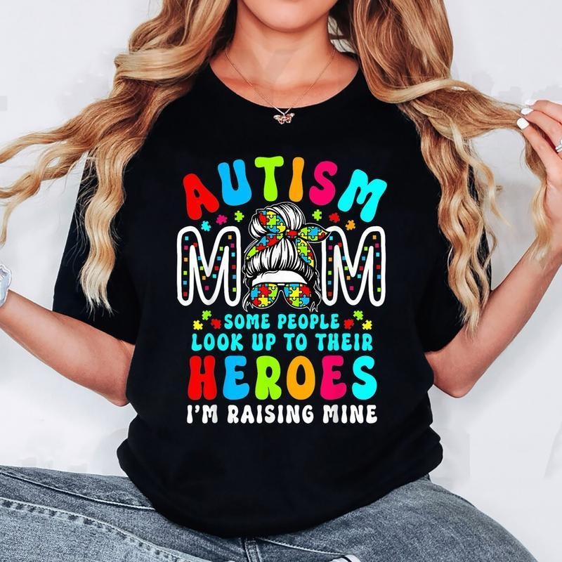 Autism Mom Raising Hero Groovy Messy Bun Autism Awareness T-Shirt Hoodie, Sweatshirt | HypeDripTees.com