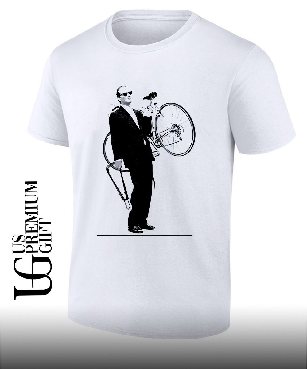 Bill Murray carrying a bicycle in Rushmore shirt