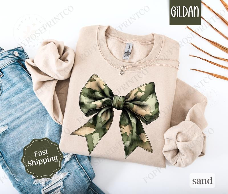 Camo Bow Sweatshirt, Military Wife Sweater, Coquette Bow Women's Crewneck T-Shirts, Hoodie | HypeDripTees.com
