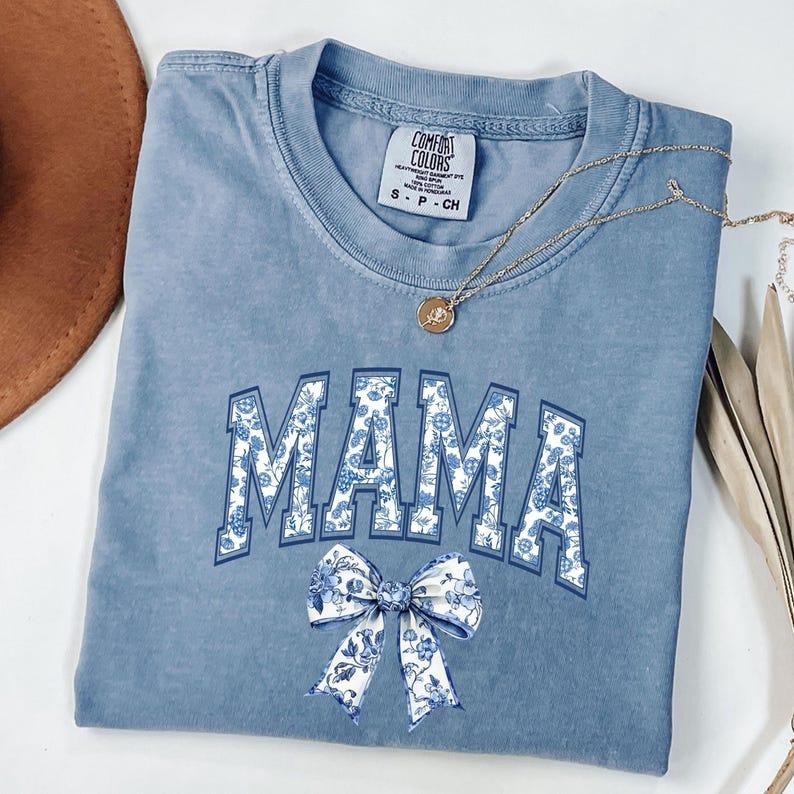 Comfort Colors Coquette Bow Mama T-Shirt, Coquette Blue Bow Shirt, Floral Mama T-Shirt, Mother's Day Gift, Mama Shirt,...