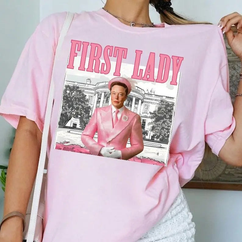 El0n M.u.s.k First Lady 2024 shirt - Unisex Heavy Cotton Tee - Comfort, Basic Hoodie, Sweatshirt | HypeDripTees.com