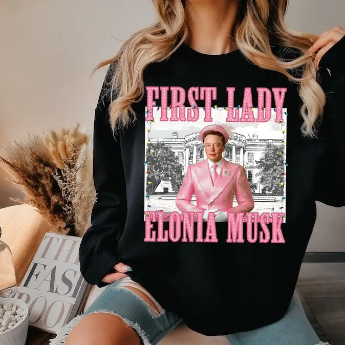 Elonia Mu.sk First Lady Christmas 2024 shirt - Unisex Heavy Cotton Tee Basic Hoodie, Sweatshirt | HypeDripTees.com