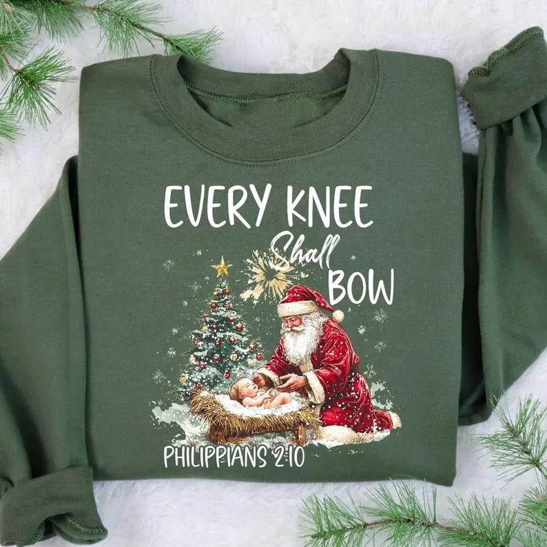 Every Knee Shall Bow Nativity Scene Santa Claus Kneeling Santa Baby Jesus T-Shirts, Hoodie, Sweatshirt