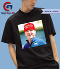 Gavin Newsom wearing Make Melania Come Again hat shirt