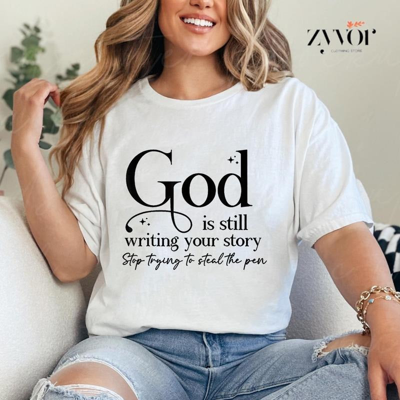 God Is Still Writing Your Story Stop Trying To Steal The Pen Shirt Casual Style Crew Neck Short Sleeve T-Shirt Tops...
