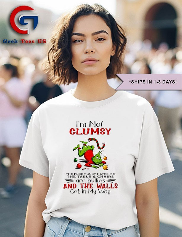 Grinch I’m not clumsy the floor just hates me the table and chairs are bullies Christmas shirt