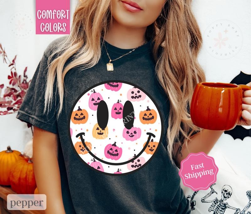 Halloween Happy Face Shirt Comfort Colors, Cute Pumpkin Tshirt for Women,  Spooky Season Shirt Oversized Crewneck Tee...