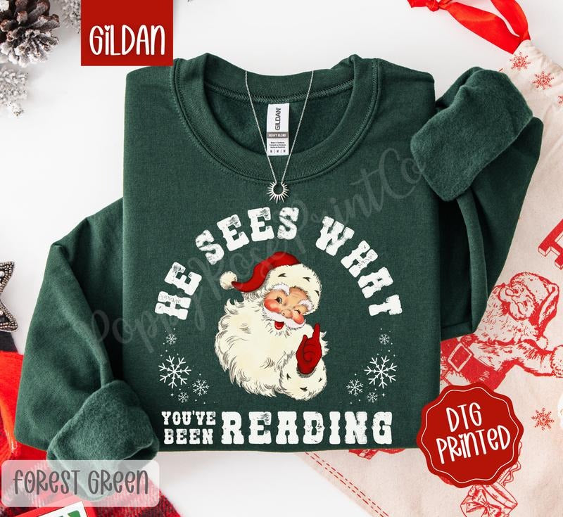 He Sees What You've Been Reading Sweatshirt, Trendy Women's Christmas Sweater T-Shirts, Hoodie | HypeDripTees.com