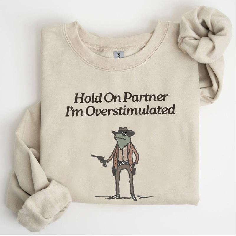 Hold On Partner I'm Overstimulated Sweatshirt, Unisex Funny Cotton Graphic Tee, Casual Streetwear Top for Men and Women...