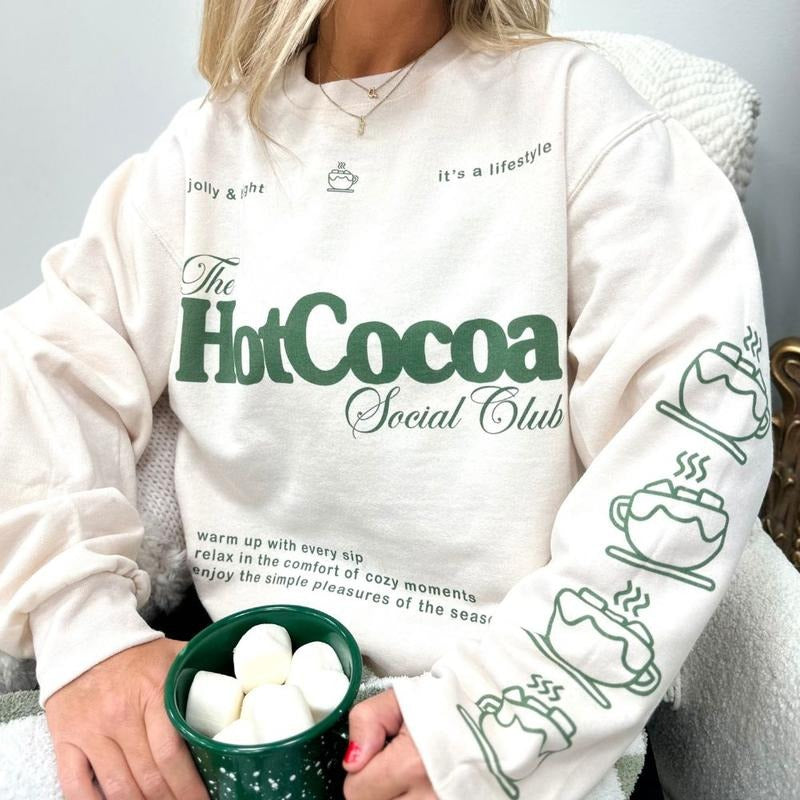 'Hot Cocoa Social Club' Crewneck Sweatshirt, Festive Holiday Vibe, Cute Sleeve Print T-Shirts, Hoodie | HypeDripTees.com