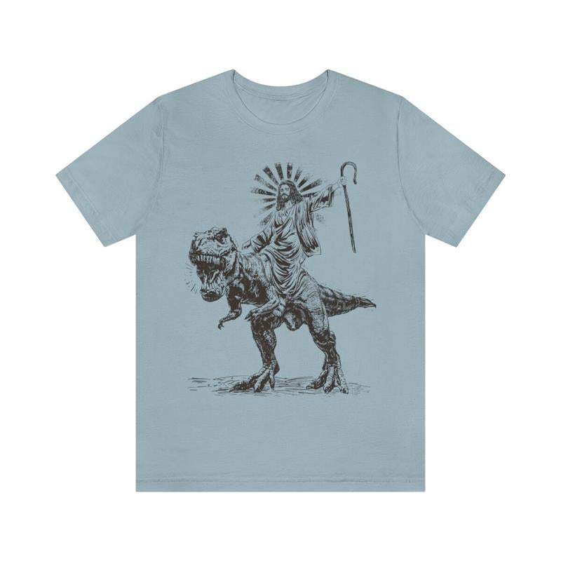 Jesus Riding T rex Dinosaur Shirt | Jesus T-shirt | Wild Dinosaur Sweatshirt Hoodie | HypeDripTees.com