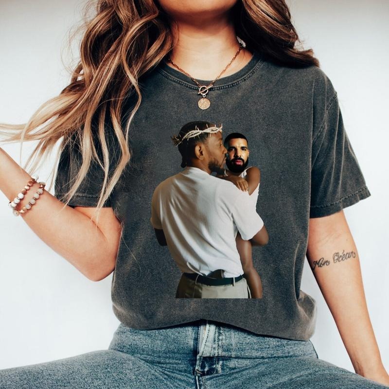 Kendrick Lamar Holding Baby Drake T-Shirt Top Womenswear Underwear Lady Hoodie, Sweatshirt | HypeDripTees.com