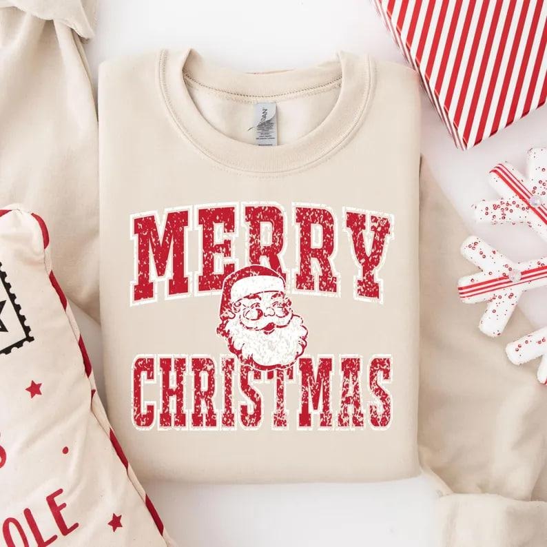 Merry Christmas Santa sweatshirt with a fun collage design. Retro Santa Claus and Christmas university style sweater,...