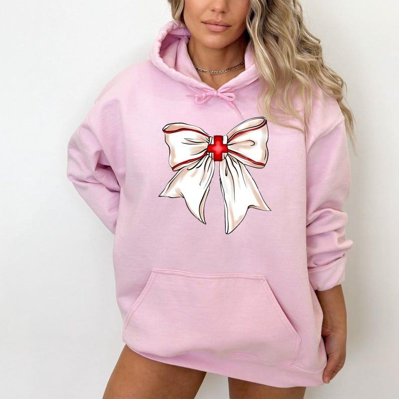 Nurse Bow Hoodie, Gift For RN Shirt, Nursing Student Gift, Coquette Nurse Shirt, Xmas Gift For Nurse, Nurse Shirt, Unisex...