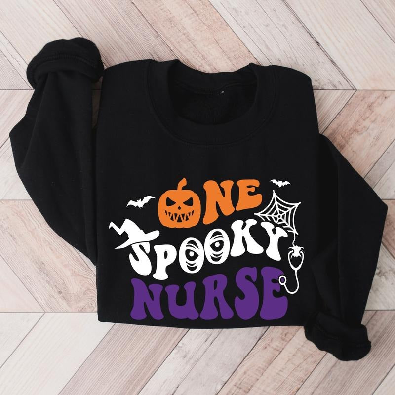 One Spooky Nurse Sweatshirt, Spooky Nurse Gift Hoodie, Matching Halloween Nurse Crew Sweater, Unisex Nursing Student Long...