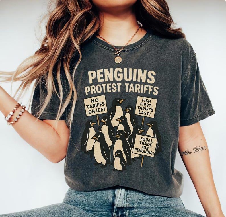 Penguins Protest Tariffs Shirt, Funny Tariffs Shirt, Funny Penguin Graphic Tee Hoodie, Sweatshirt | HypeDripTees.com