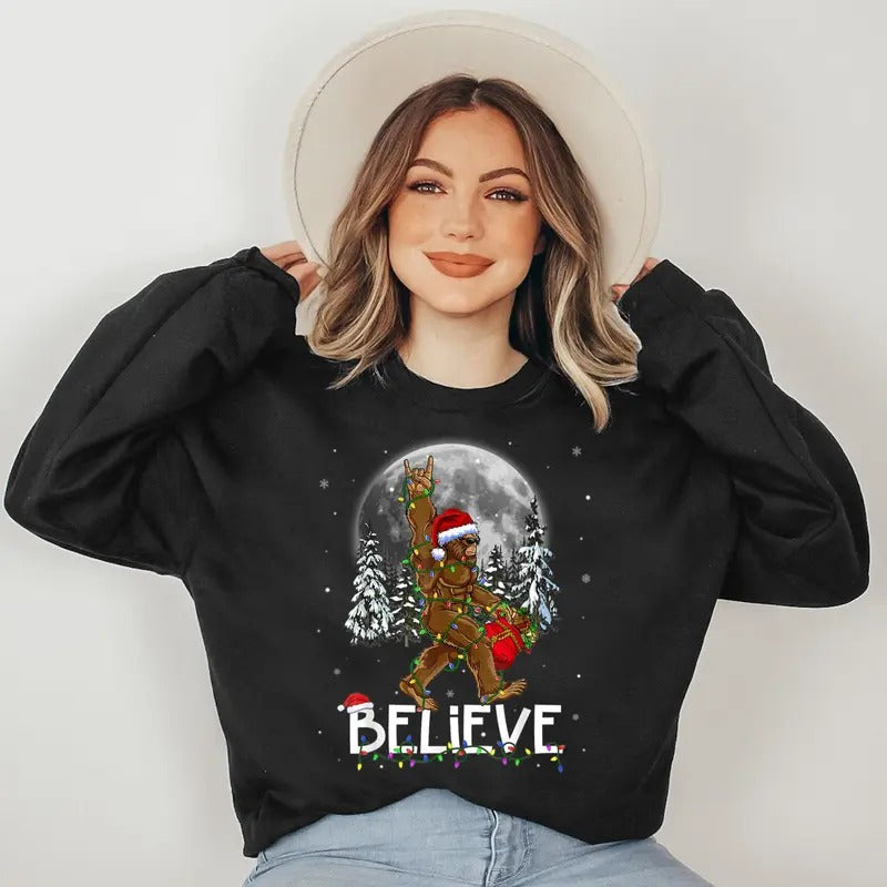 Santa Bigfoot Christmas Lights Funny Sasquatch Believe Xmas Sweatshirt T-Shirts, Hoodie | HypeDripTees.com