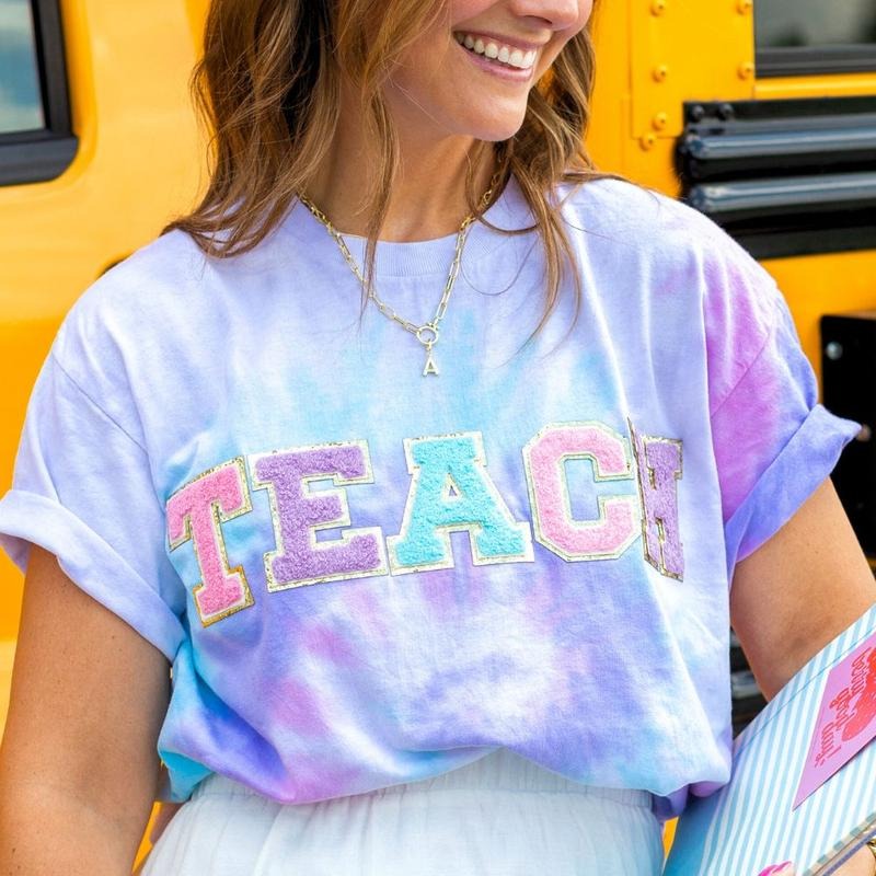 'Teach In Technicolor' Tie Dye Letter Patch T-Shirt Hoodie, Sweatshirt | HypeDripTees.com