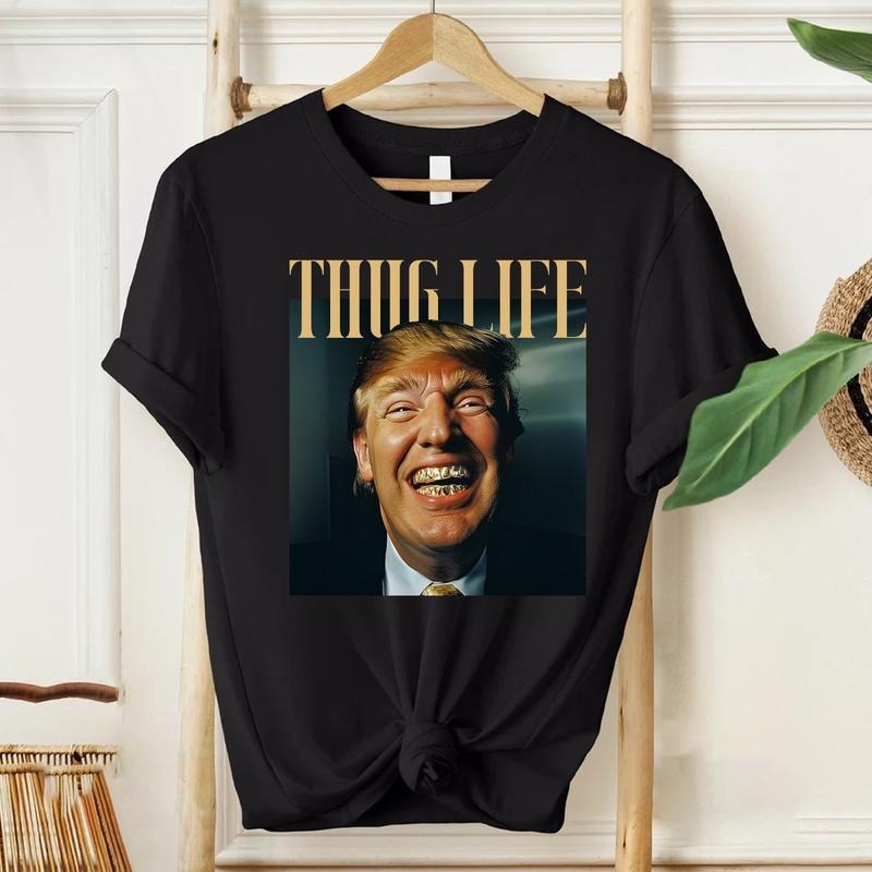TruUmMp Golden Grillz MA GA Mugshot Thuglife T-Shirt,Trending Tee Shirt, Country Music Concert Merch, Unisex T-Shirt"...