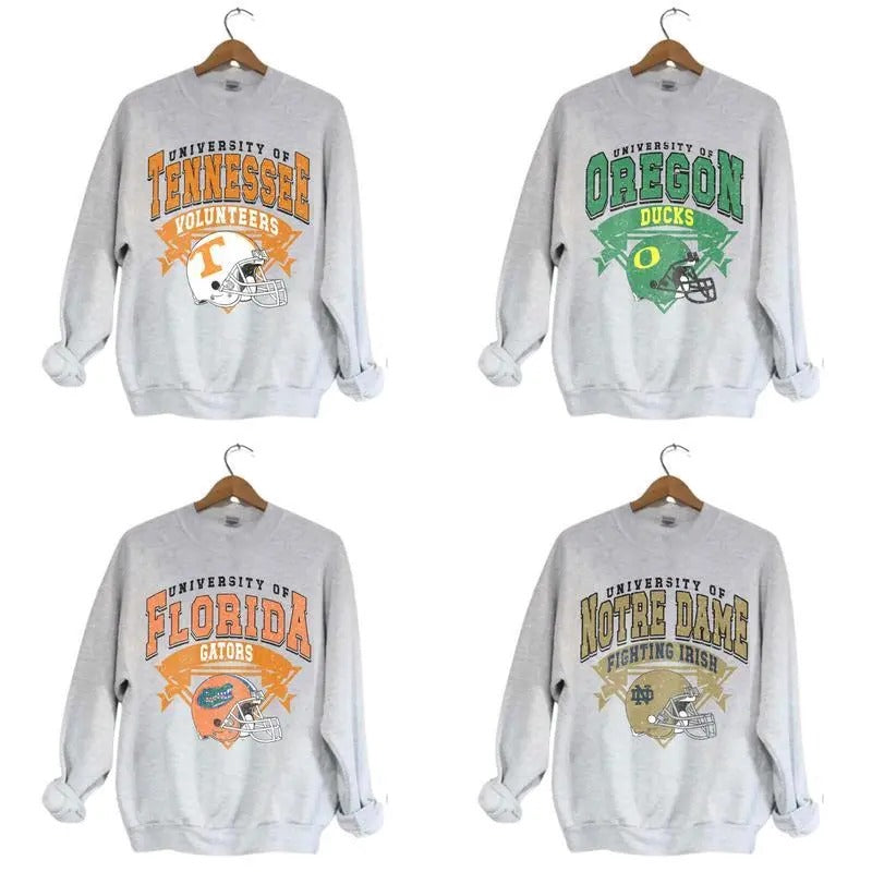 Vintage Helmet All Teams University NCAA Football Team Collection Ash Grey Crewneck Sweatshirt, Graphic NCAA Sport Team...