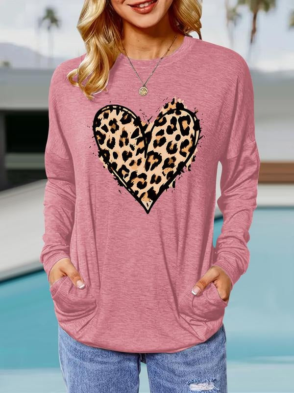Women's Heart Print Round Neck Long Sleeve Pullover, Casual Loose-Fit T-Shirt with Pockets, Comfortable Spring & Fall...